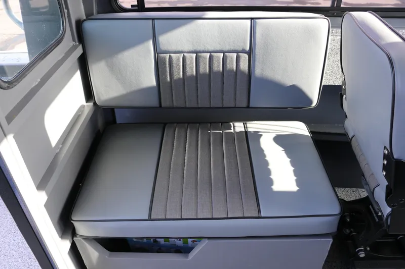 Slide: The Image of 2026 Alumaweld Intruder Hard Top 24 interior seating with gray upholstery. - 15