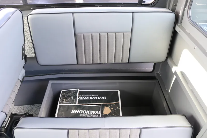 Slide: The Image of 2026 Alumaweld Intruder Hard Top 24 interior storage compartment with Shockwave marine suspension system. - 18