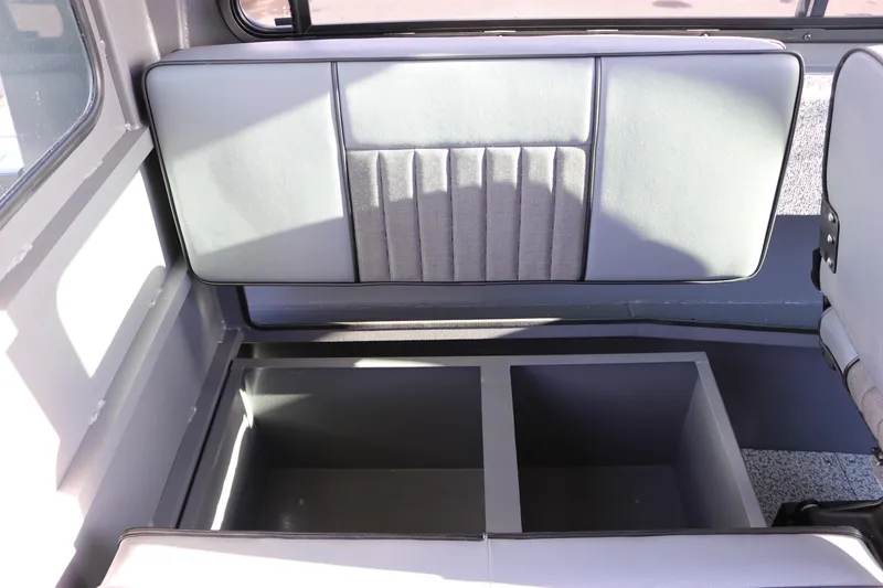 Slide: The Image of 2026 Alumaweld Intruder Hard Top 24 interior storage compartments with cushioned seating. - 19