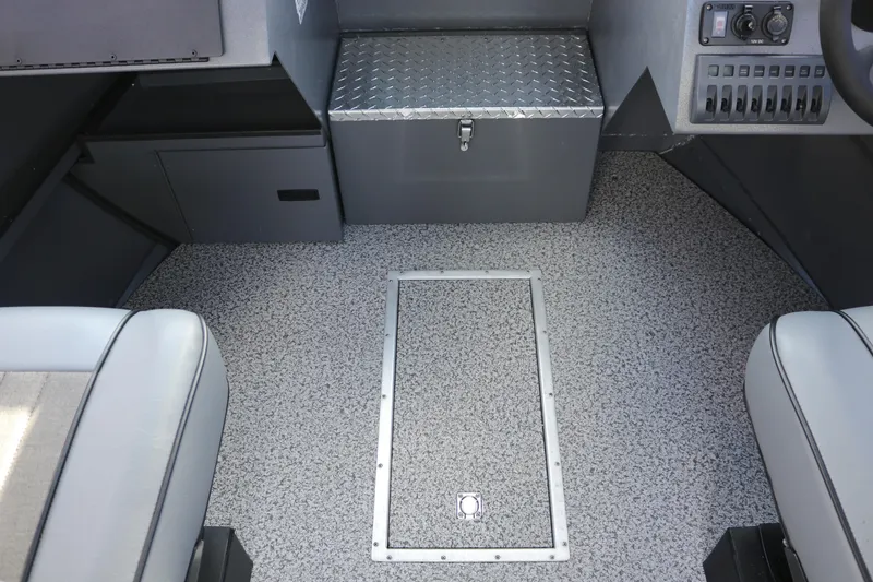 Slide: The Image of 2026 Alumaweld Intruder Hard Top 24 interior with textured flooring and storage compartments. - 20