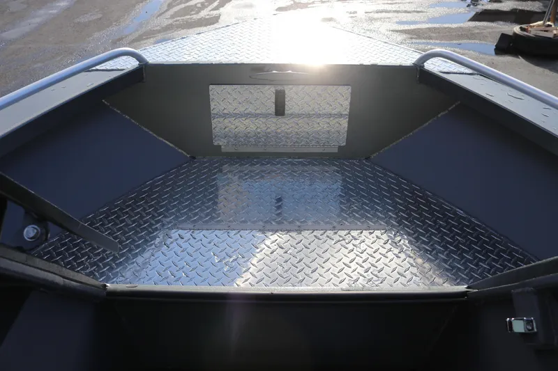 Slide: The Image of 2026 Alumaweld Intruder Hard Top 24 boat interior with diamond plate flooring. - 22
