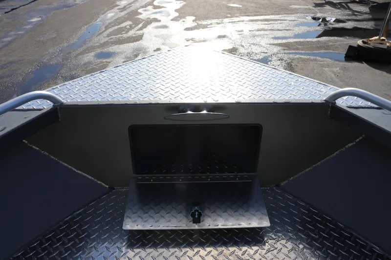 Slide: The Image of 2026 Alumaweld Intruder Hard Top 24 boat deck with diamond plate flooring. - 23