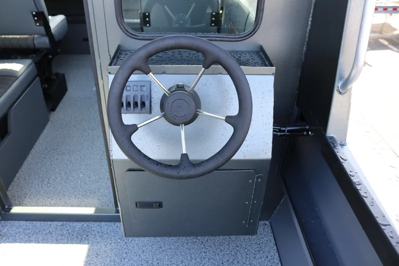 Slide: The Image of Steering wheel of 2026 Alumaweld Intruder Hard Top 24 boat interior. - 27