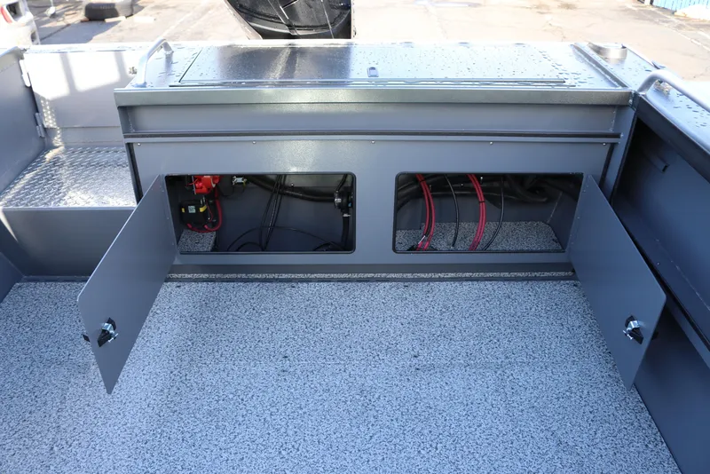 Slide: The Image of 2026 Alumaweld Intruder Hard Top 24 boat interior with open storage compartments. - 29