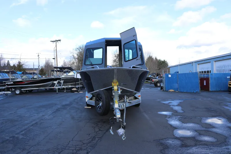 Slide: The Image of 2026 Alumaweld Intruder Hard Top 24 boat on trailer in parking lot. - 3