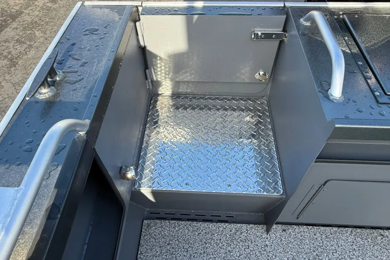 Slide: The Image of Interior of 2026 Alumaweld Intruder Hard Top 24 boat with diamond plate flooring. - 31