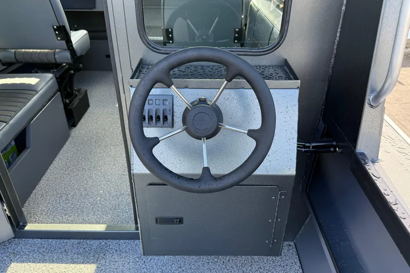 Slide: The Image of Steering wheel of 2026 Alumaweld Intruder Hard Top 24 boat interior. - 34