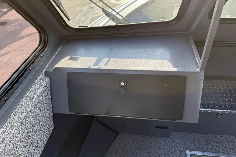 Slide: The Image of Interior view of 2026 Alumaweld Intruder Hard Top 24 boat dashboard. - 39