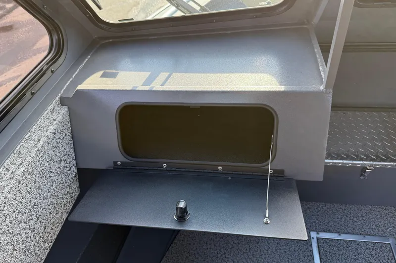Slide: The Image of 2026 Alumaweld Intruder Hard Top 24 interior storage compartment with open hatch. - 41