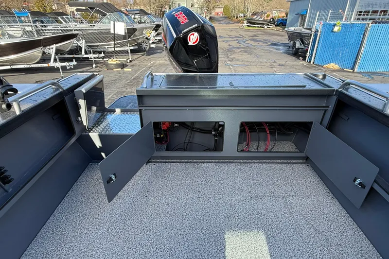 Slide: The Image of 2026 Alumaweld Intruder Hard Top 24 boat interior with open storage compartments. - 45