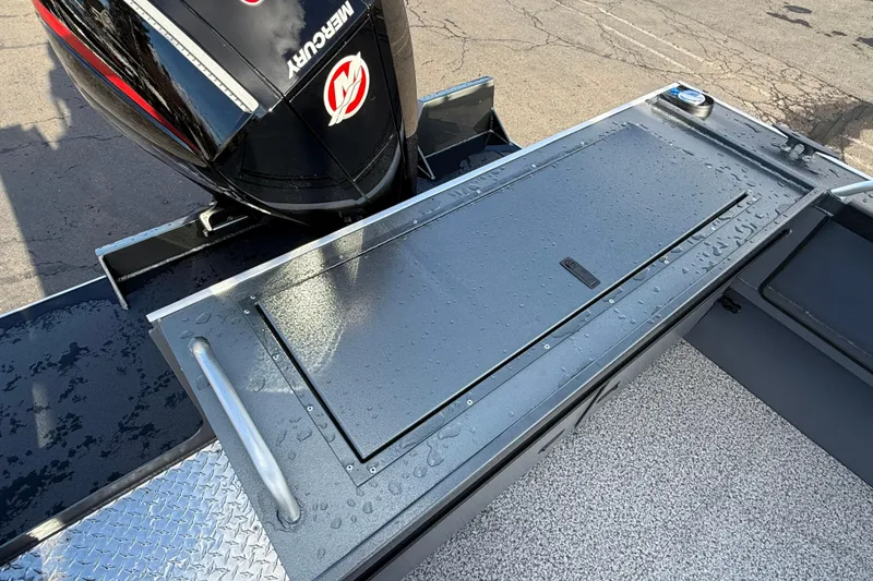 Slide: The Image of 2026 Alumaweld Intruder Hard Top 24 boat with Mercury engine, wet deck surface. - 47