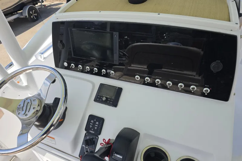 Slide: The Image of 2020 Sportsman Heritage 211 Center Console dashboard with steering wheel and electronic controls. - 17