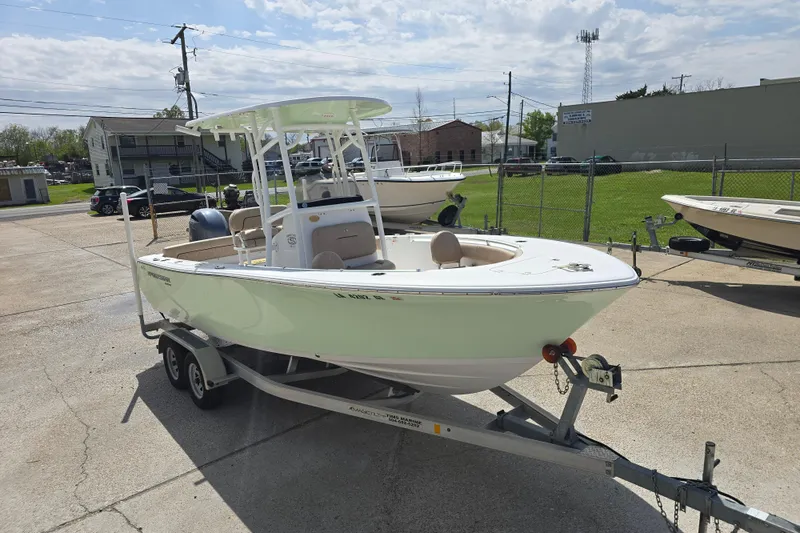Slide: The Image of 2020 Sportsman Heritage 211 Center Console boat on trailer in outdoor lot. - 3