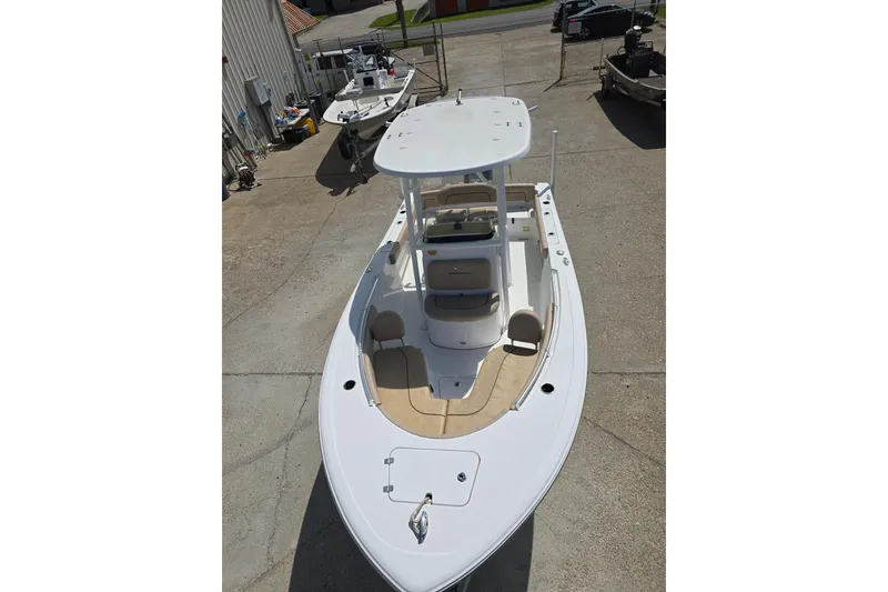 Slide: The Image of 2020 Sportsman Heritage 211 Center Console boat in a marina setting. - 8