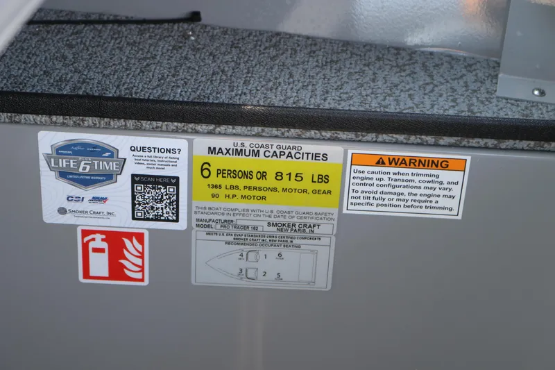 Slide: The Image of Boat capacity and safety labels on Smoker Craft Pro Tracer 162, 2026 model. - 11