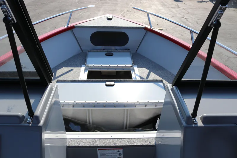 Slide: The Image of Interior view of 2026 Smoker Caft Pro Tracer 162 boat, featuring storage compartments. - 14