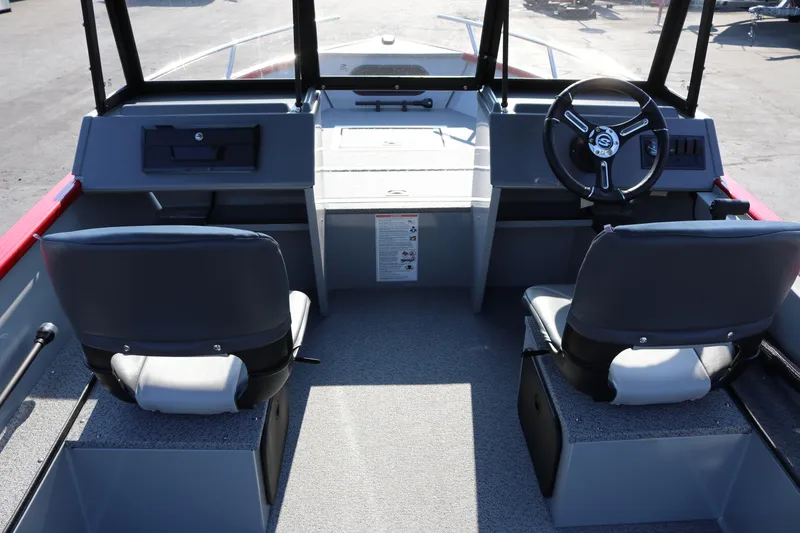 Slide: The Image of Interior of 2026 Smoker Caft Pro Tracer 162 boat with dual seats and steering console. - 4