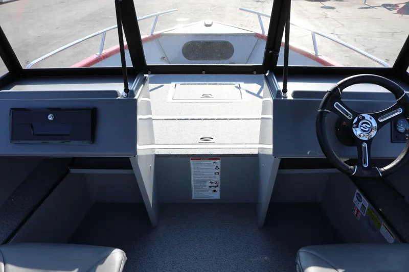 Slide: The Image of Interior view of 2026 Smoker Caft Pro Tracer 162 boat cockpit with steering wheel. - 5