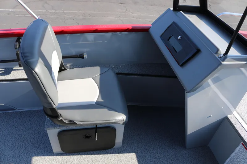 Slide: The Image of Interior of 2026 Smoker Caft Pro Tracer 162 boat with gray seating and control panel. - 8