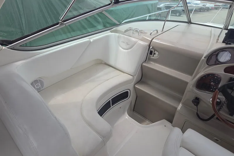 Slide: The Image of 2006 Sea Ray Sundancer 280 cockpit with white seating and control panel. - 15