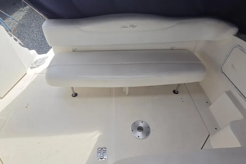 Slide: The Image of 2006 Sea Ray Sundancer 280 boat interior with white seating and clean deck. - 16