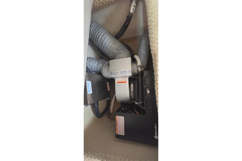 Slide: The Image of 2006 Sea Ray Sundancer 280 air conditioning unit with ductwork and wiring. - 37