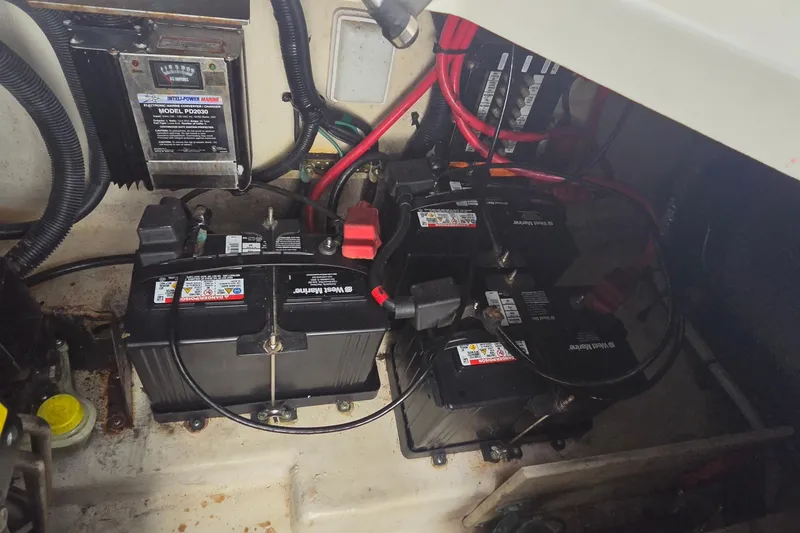 Slide: The Image of Engine compartment of 2006 Sea Ray Sundancer 280 with batteries and wiring. - 38