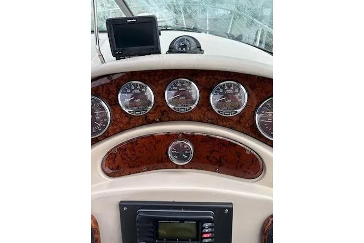 Slide: The Image of Dashboard of 2006 Sea Ray Sundancer 280 with gauges and navigation equipment. - 4