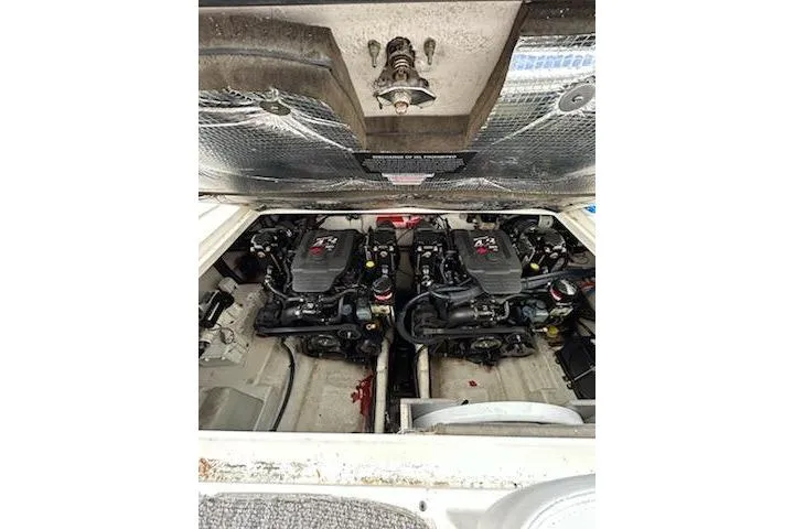 Slide: The Image of Engine compartment of a 2006 Sea Ray Sundancer 280 with dual engines visible. - 8