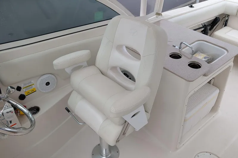 Slide: The Image of Captain's chair and sink area on 2014 Sailfish 275 DC boat. - 15