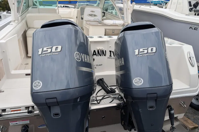 Slide: The Image of 2014 Sailfish 275 DC boat with twin Yamaha 150 fuel injection engines. - 5