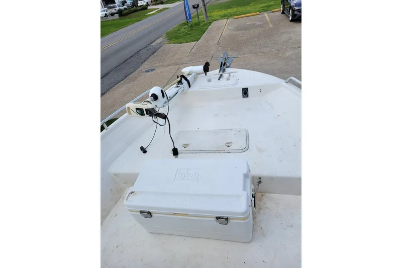 Slide: The Image of 2004 Sea Chaser 1950 RG boat deck with cooler and trolling motor. - 11