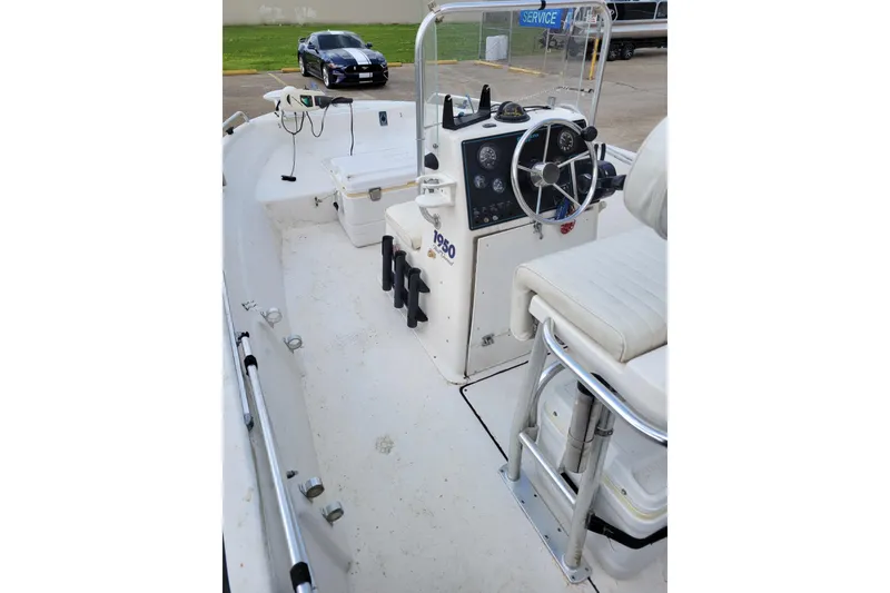 Slide: The Image of 2004 Sea Chaser 1950 RG boat interior with steering console and seating. - 14