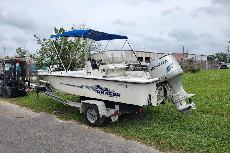 Slide: The Image of 2004 Sea Chaser 1950 RG boat with Honda outboard motor on trailer. - 17