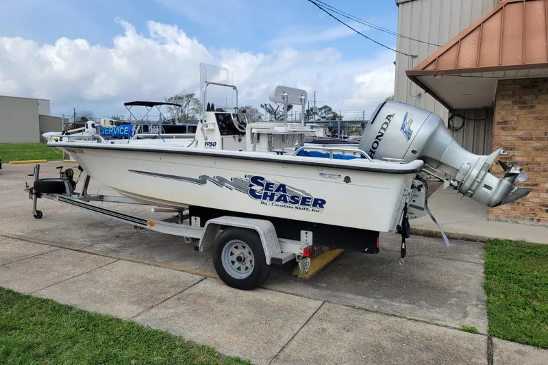 Slide: The Image of 2004 Sea Chaser 1950 RG boat on trailer with Honda outboard motor. - 5