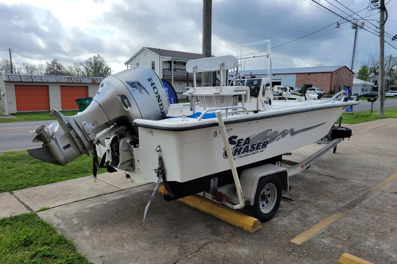 Slide: The Image of 2004 Sea Chaser 1950 RG boat on trailer with Honda outboard motor. - 6