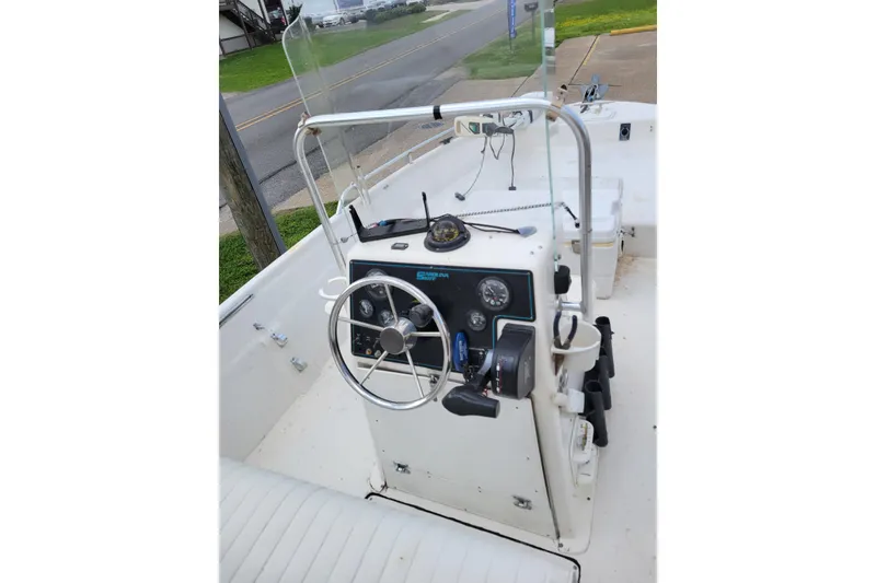 Slide: The Image of 2004 Sea Chaser 1950 RG boat console with steering wheel and controls. - 8