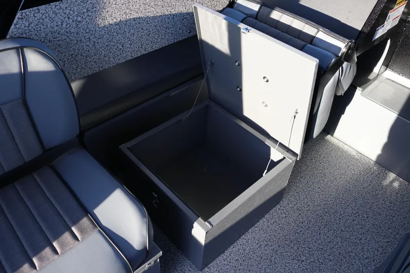 Slide: The Image of 2026 Alumaweld Stryker X202 boat interior with open storage compartment and seating. - 10