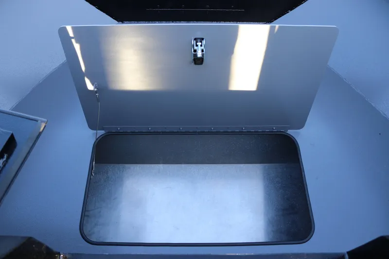 Slide: The Image of Open storage compartment in 2026 Alumaweld Stryker X202 boat. - 14