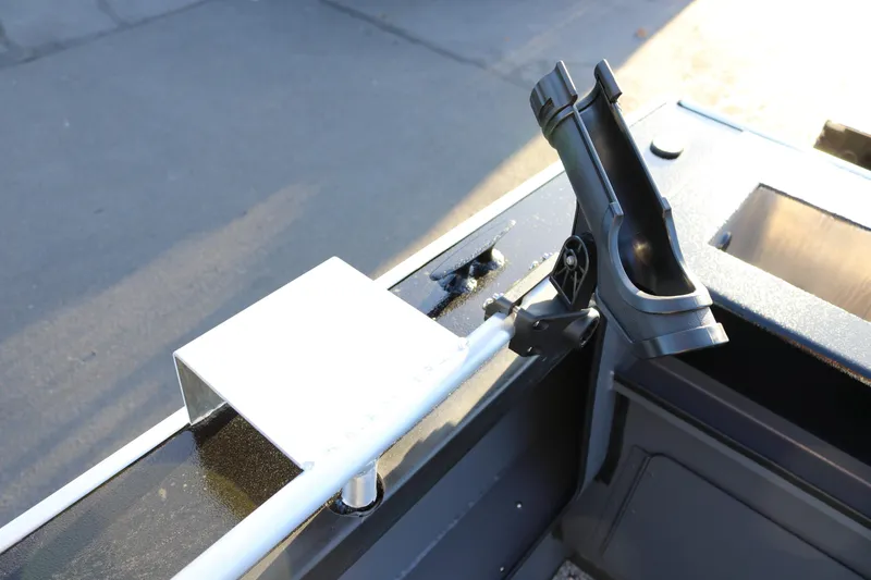Slide: The Image of 2026 Alumaweld Stryker X202 boat detail with rod holder and metal bracket. - 17