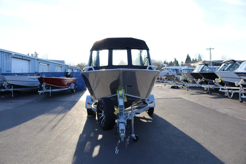 Slide: The Image of 2026 Alumaweld Stryker X202 boat on trailer in a dealership lot. - 18