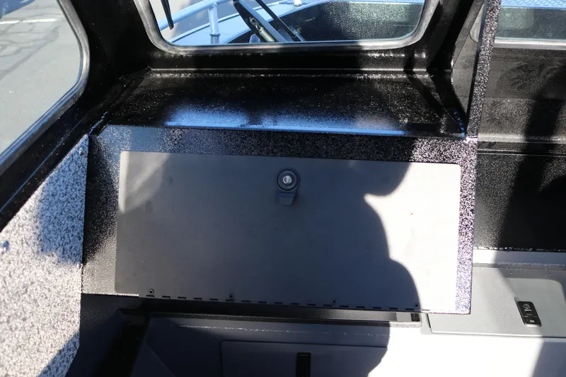 Slide: The Image of Interior view of 2026 Alumaweld Stryker X202 boat with storage compartment. - 22