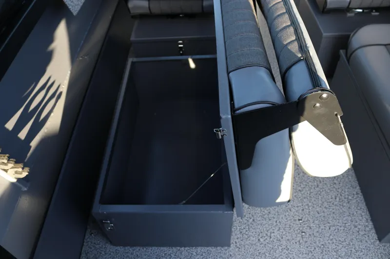 Slide: The Image of Open storage compartment in 2026 Alumaweld Stryker X202 boat, featuring cushioned seating. - 35