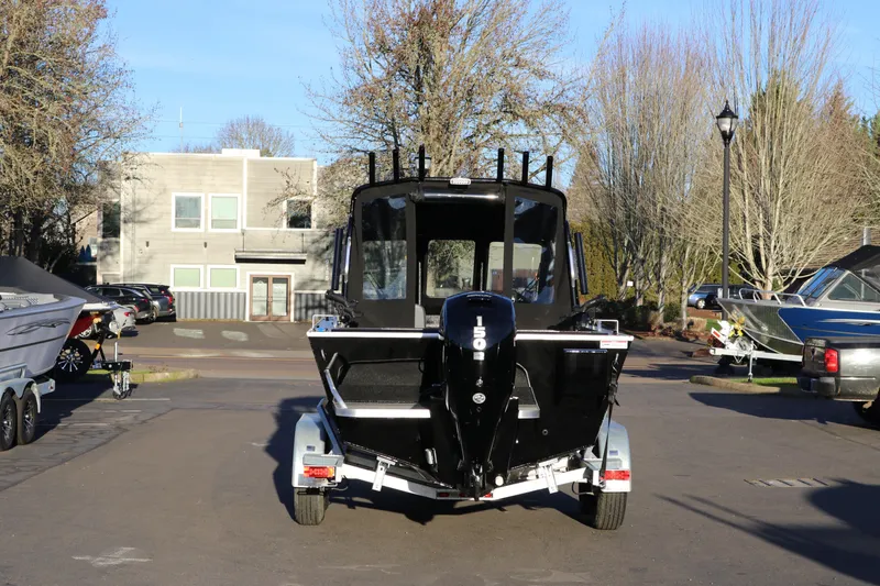 Slide: The Image of 2026 Alumaweld Stryker X202 boat on trailer, parked outdoors. - 38