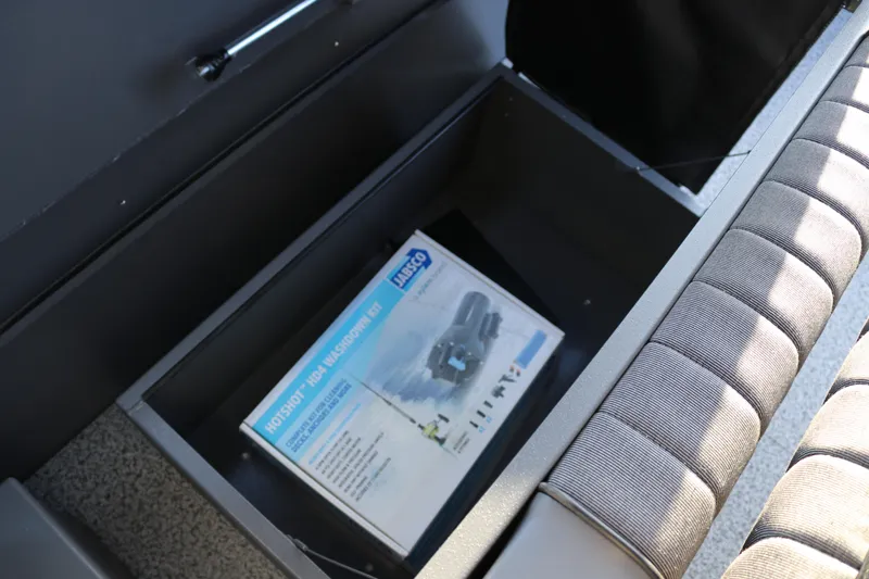 Slide: The Image of Storage compartment in 2026 Alumaweld Stryker X202 boat with Jabsco washdown kit. - 6