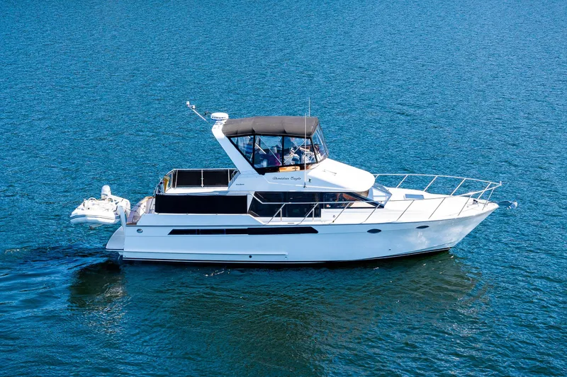 Slide: The Image of 1989 Ocean Alexander 42' Sundeck, featuring sleek design and spacious deck. - 1