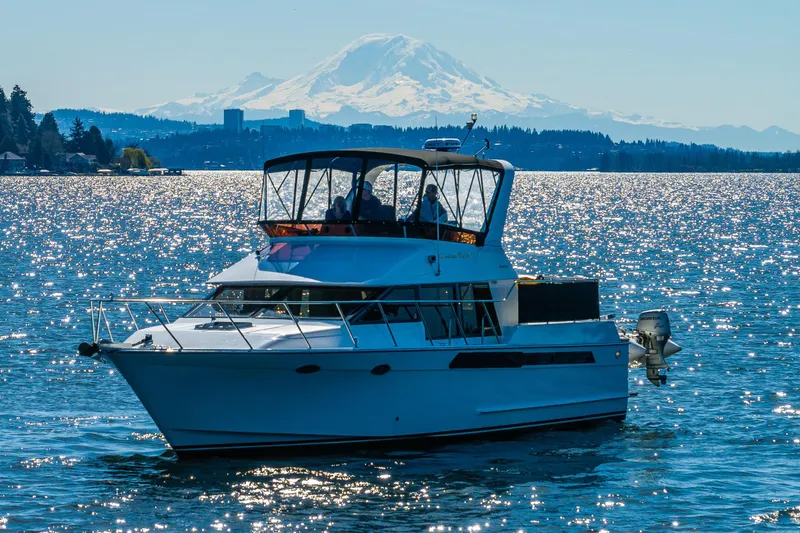 Slide: The Image of Ocean Alexander 42 yacht cruising on sparkling water with mountain backdrop, 1989 model. - 14