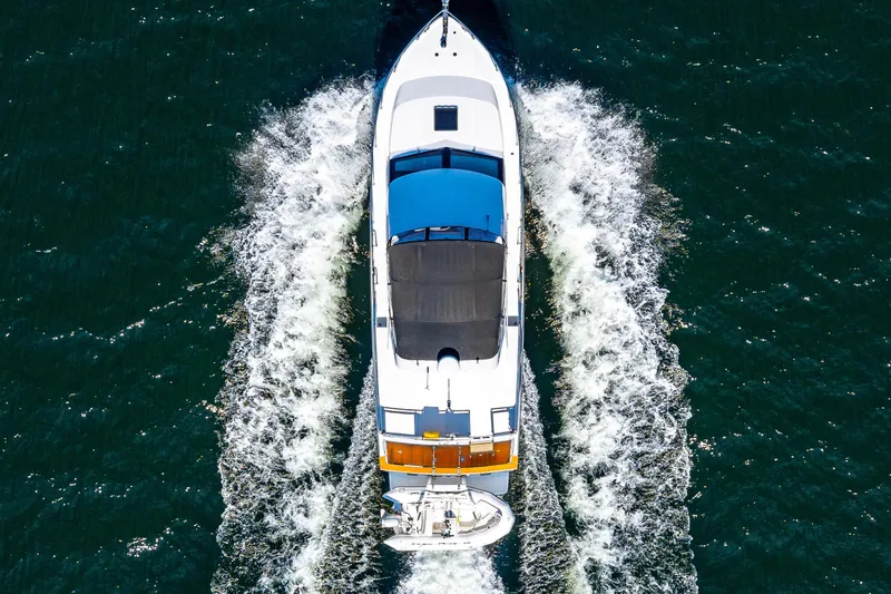 Slide: The Image of Aerial view of 1989 Ocean Alexander 42 yacht cruising on open water. - 26