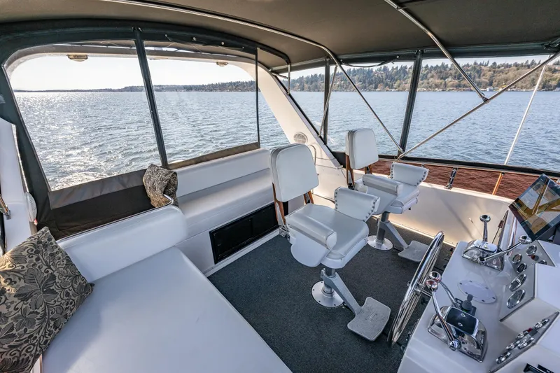 Slide: The Image of Interior view of 1989 Ocean Alexander 42 yacht with helm and seating area. - 29