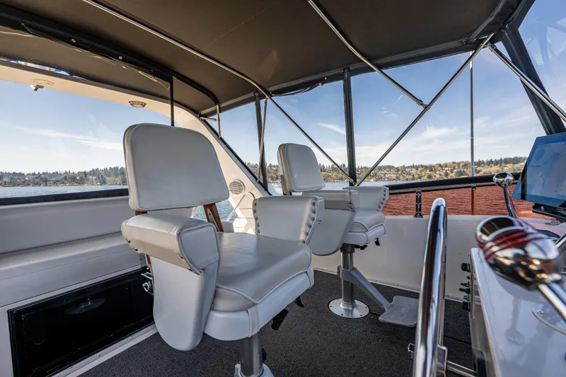 Slide: The Image of Interior view of 1989 Ocean Alexander 42 yacht helm with two captain chairs. - 32